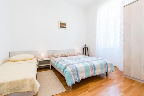 Katil atau katil-katil dalam bilik di Apartmani Rina