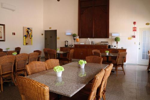 a dining room with two tables and chairs at Zar Culiacan in Culiacán