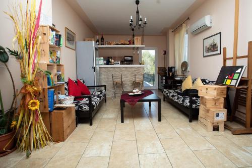 a living room with couches and a table and a fireplace at Villa Liburnia in Livorno