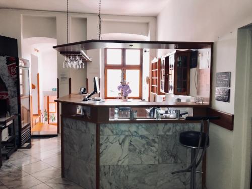 a kitchen with a large counter with a sink at Club M.K.M. Modra in Modra