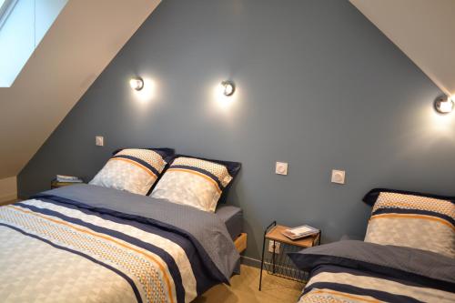 מיטה או מיטות בחדר ב-Gîte "Le Bérétyn"