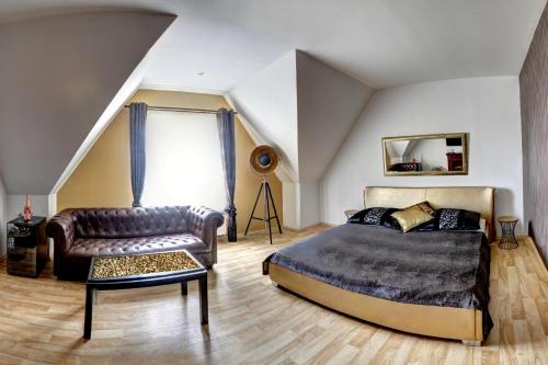 Posteľ alebo postele v izbe v ubytovaní Penzion Tillerova vila