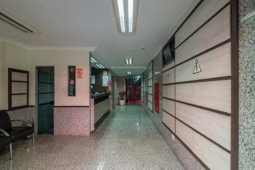 a hallway of a building with a hallway at Soneca Plaza Hotel in Sao Paulo