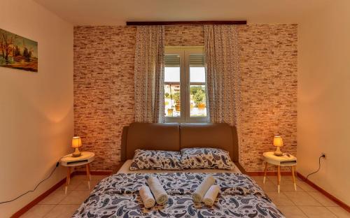 Postel nebo postele na pokoji v ubytování Apartments Dora Victoria Dream