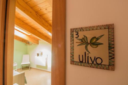 a sign on the wall of a room at B&B Sotto un Tetto in Cetara