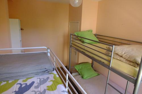 Ένα ή περισσότερα κρεβάτια σε δωμάτιο στο Appartements Coeur de Village