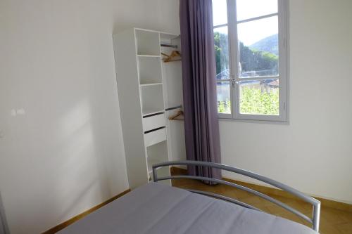 Ένα ή περισσότερα κρεβάτια σε δωμάτιο στο Appartements Coeur de Village