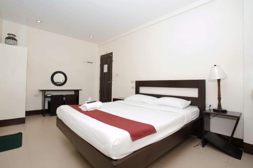 Una cama o camas en una habitación de DaHome Pension
