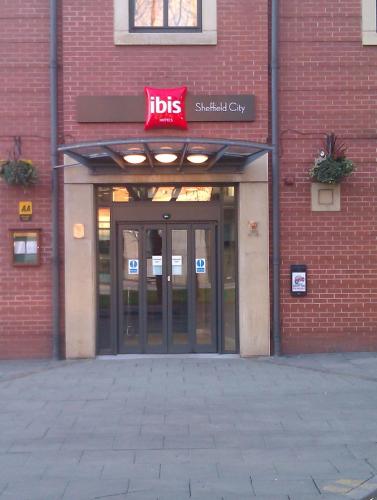 a brick building with a lifts sign over the door at Ibis Sheffield City in Sheffield