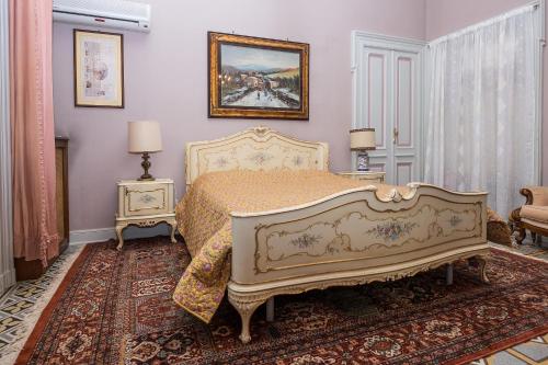 Säng eller sängar i ett rum på Casa di Nonna