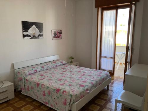 Postel nebo postele na pokoji v ubytování a casa di Manu