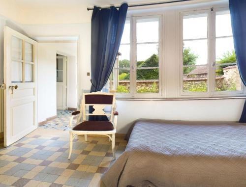 Un pat sau paturi într-o cameră la Les Rouges Gorges