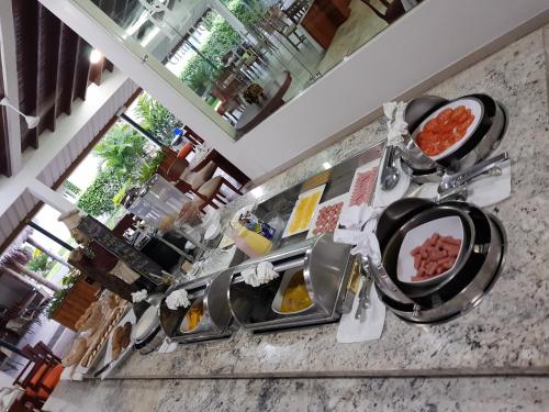 a counter with two plates of food on it at Gran Hotel De Lago - Lago Agrio in Nueva Loja