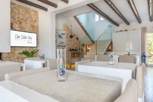 A bed or beds in a room at Cas Cabo Nou Agroturismo Adults Only