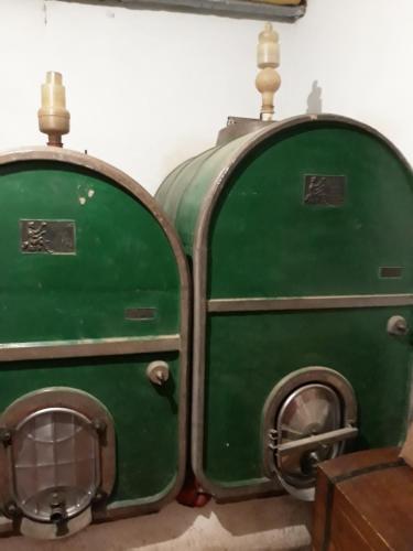 two green machines sitting next to each other at La Vecchia Quercia in Pergine Valdarno