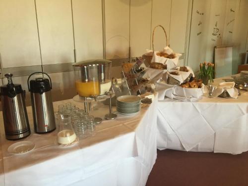a table with a buffet of food on it at Zur Eldenburg in Lübz
