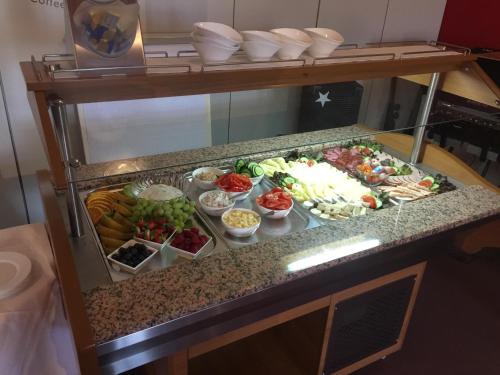 a buffet with different types of food on a counter at Zur Eldenburg in Lübz