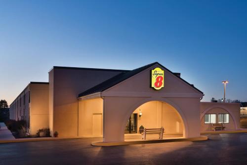 a building with a sign on the side of it at Super 8 by Wyndham Chambersburg I-81 in Chambersburg