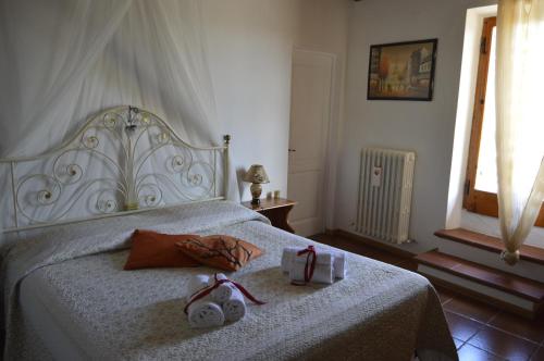 Ein Bett oder Betten in einem Zimmer der Unterkunft Agriturismo La Camporena