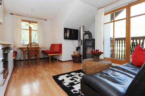 a living room with a couch and a table at Villa 17 in Gaschurn