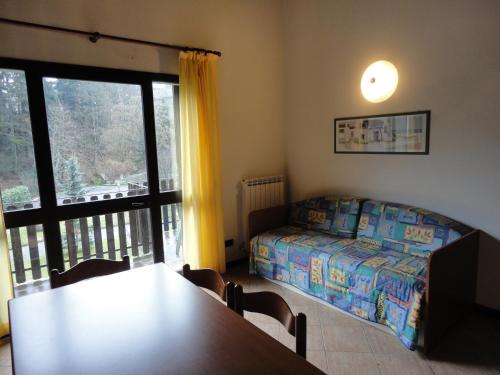 מיטה או מיטות בחדר ב-Residence Il Mulinaccio
