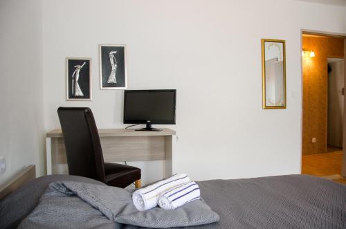 TV a/nebo společenská místnost v ubytování Guesthouse Unique