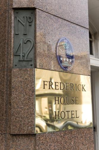 a building with a sign for a hotel at Frederick House Hotel in Edinburgh
