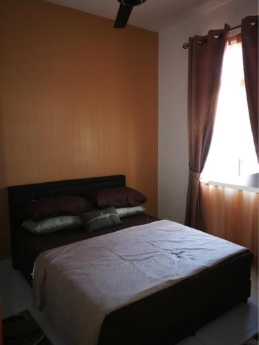 Postel nebo postele na pokoji v ubytování Aryan Homestay