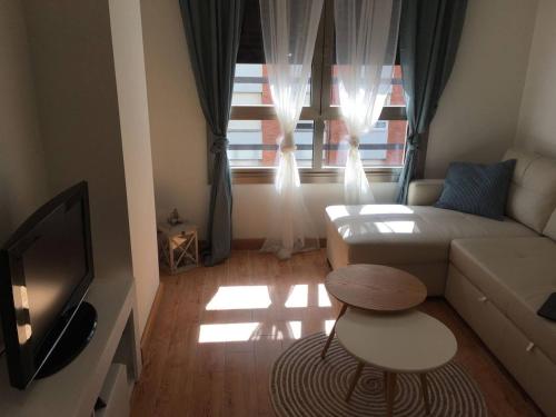 TV a/nebo společenská místnost v ubytování Apartamento Playa Poniente