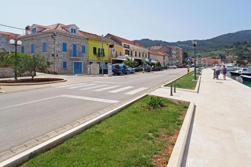 a street in a town with buildings and a road at Luxory D-Rooms in Vela Luka