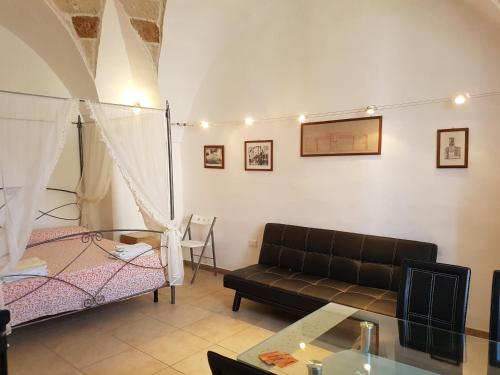 Ein Bett oder Betten in einem Zimmer der Unterkunft Calì Nitta Storic