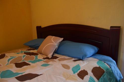 a bed with two pillows on top of it at Quilotoa Green Lake in Quilotoa