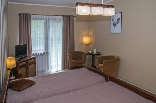 Posteľ alebo postele v izbe v ubytovaní Apartament 6 Cappucino Pod Aniołem