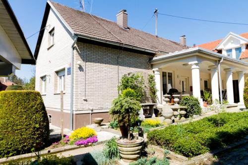 a house with a garden in front of it at Apartma in Ormoz