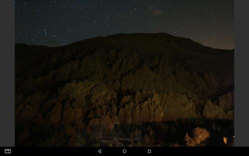 a view of a mountain at night with stars at Maison D'hote Chez La Famille in Tamellalt