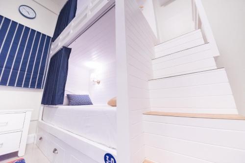 a tiny house with a bed in the middle at The Partridge Guesthouse in Cebu City