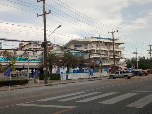 an empty street with a building in the background at Grandblue Condo 410 in Mae Pim