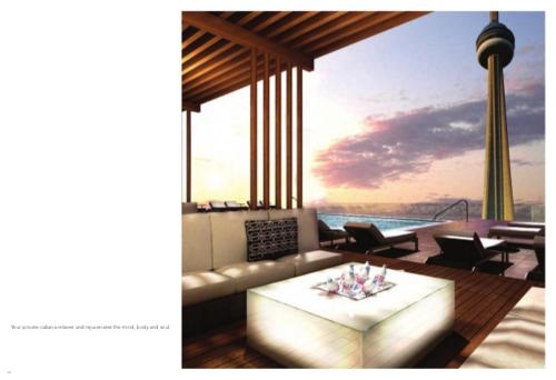 a living room with a couch and a table at Luxury condo on CN TOWER in Toronto