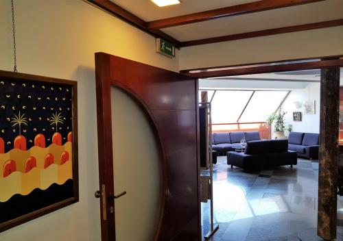a door leading into a room with a living room at Addaura Village e Congressi in Mondello