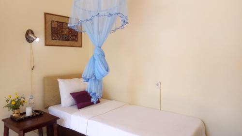 Rura Raya Homestayにあるベッド