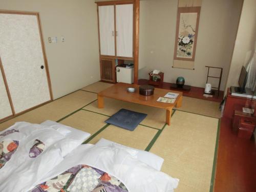 Кровать или кровати в номере Hakodate Park Hotel