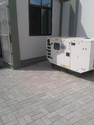 a machine sitting on the side of a building at B10 Airport Lodge in Dar es Salaam