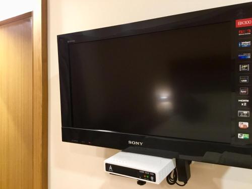 a sony flat screen tv on a wall at Sai Towers in Puttaparthi