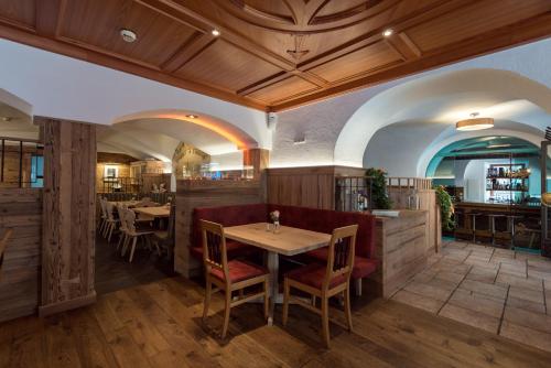 a dining room with a table and chairs at Hotel Restaurant Stöcklwirt in Sankt Johann im Pongau