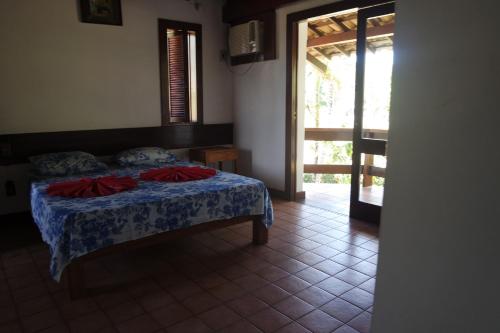 Un pat sau paturi într-o cameră la Residencial Frente a Praia