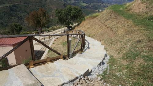 a set of stairs on top of a mountain at Mama Lina in Patti
