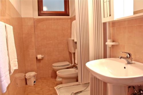 a bathroom with a white sink and a toilet at Ai Tre Parchi Bed And Bike in Randazzo