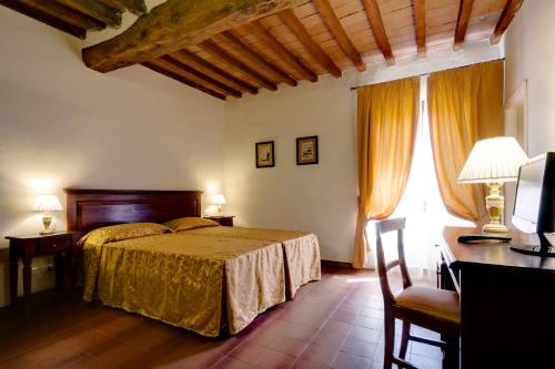 Ένα ή περισσότερα κρεβάτια σε δωμάτιο στο Hotel Il Cavallo