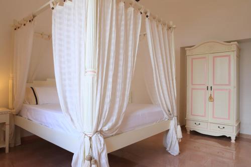 Ένα ή περισσότερα κρεβάτια σε δωμάτιο στο Villa Oltremare