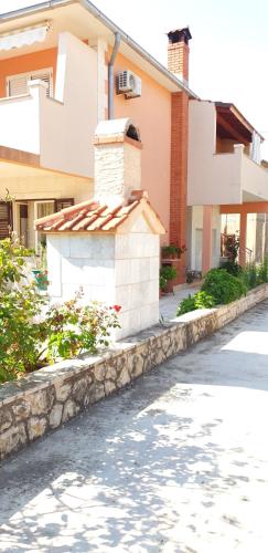a street in front of a house at Apartments and Rooms Dobrila in Jelsa